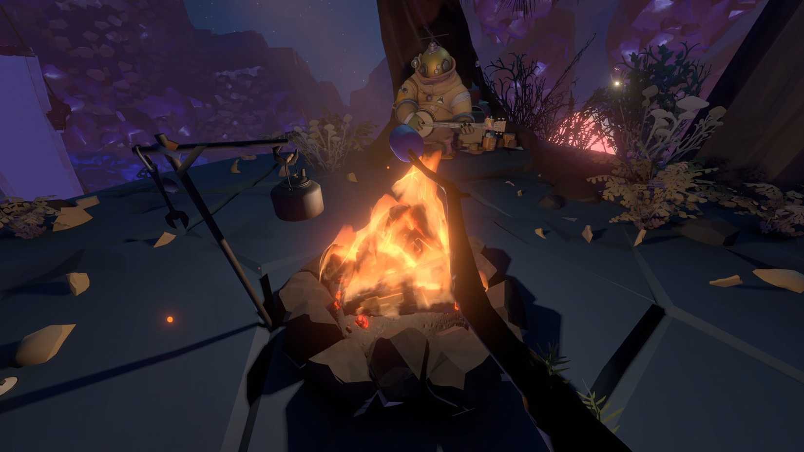 The Outer Wilds player-character sits in front of a campfire.