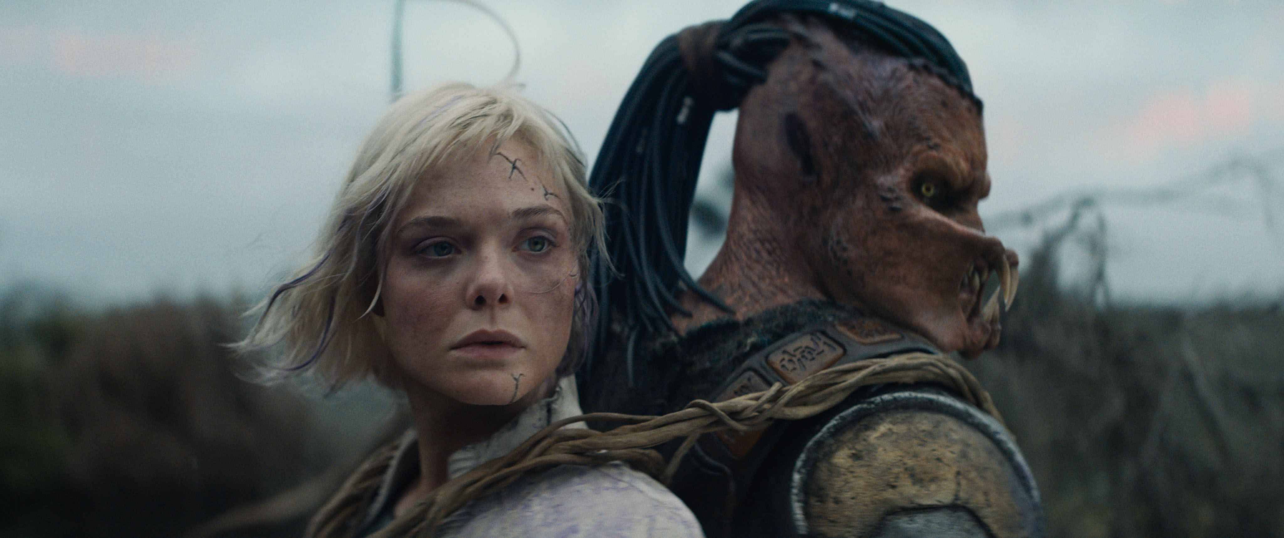Elle Fanning's synthetic character attached to a Predator