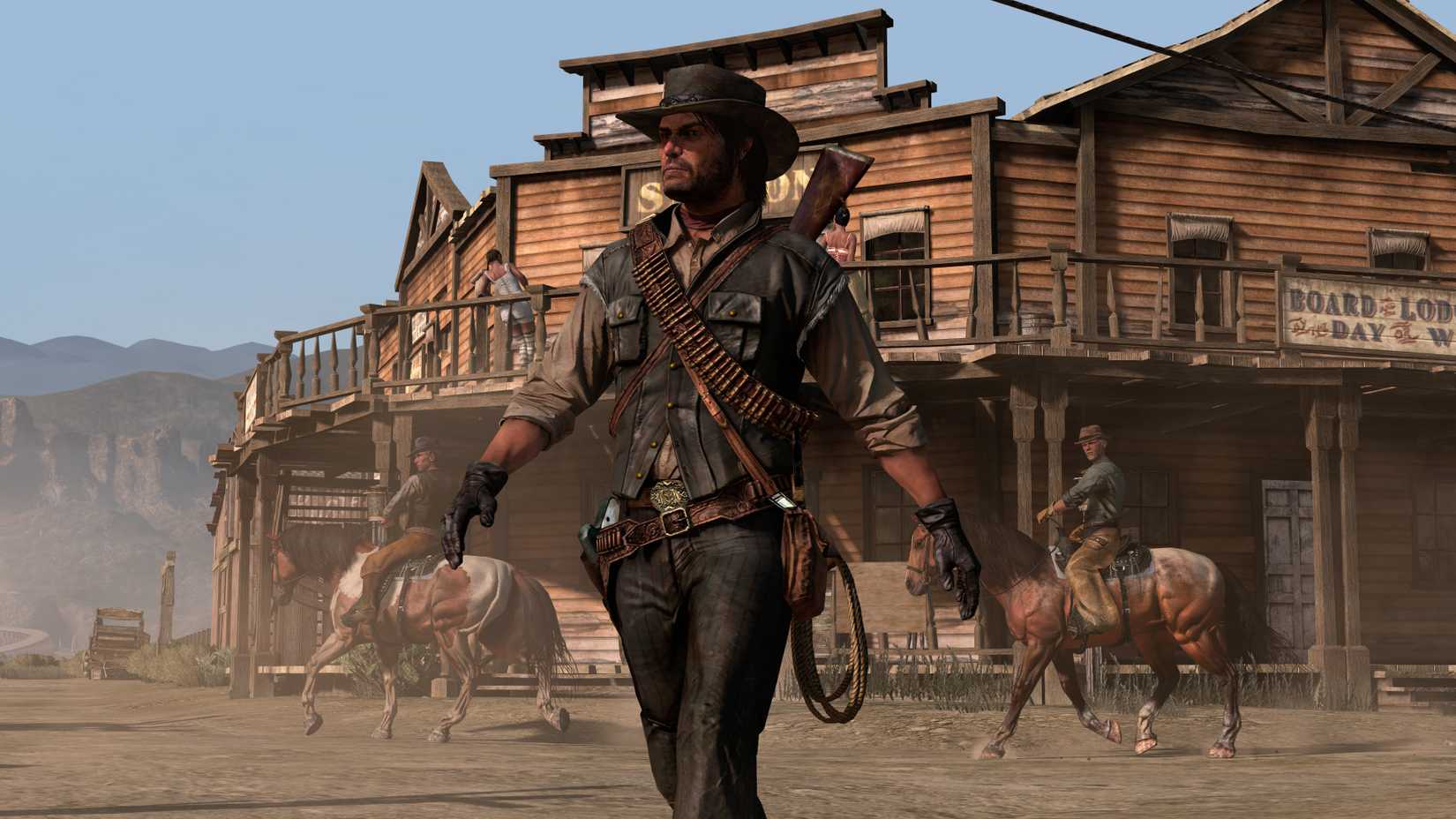 John Marston walks through a town in a screenshot from Red Dead Redemption 