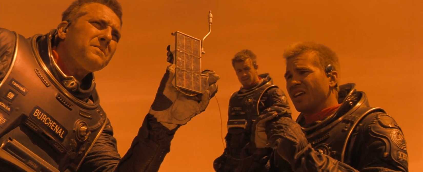 Tom Sizemore, Simon Baker, and Val Kilmer inspect structural damage to their Martian habitat.