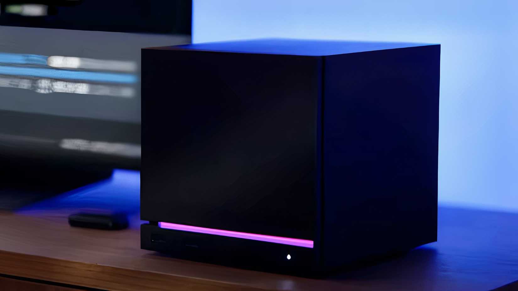 The Steam Machine: a black, cube-shaped console-PC hybrid with an LED strip at the bottom.