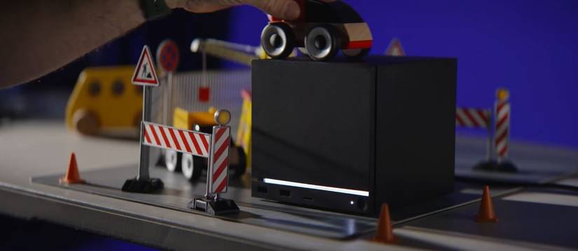 Valve's Steam Machine, as it is surrounded by a toy car and driving accoutrements.