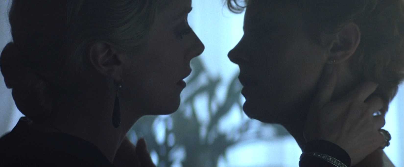 Catherine Deneuve pulls Susan Sarandon into a vampire kiss in 1983's The Hunger. 