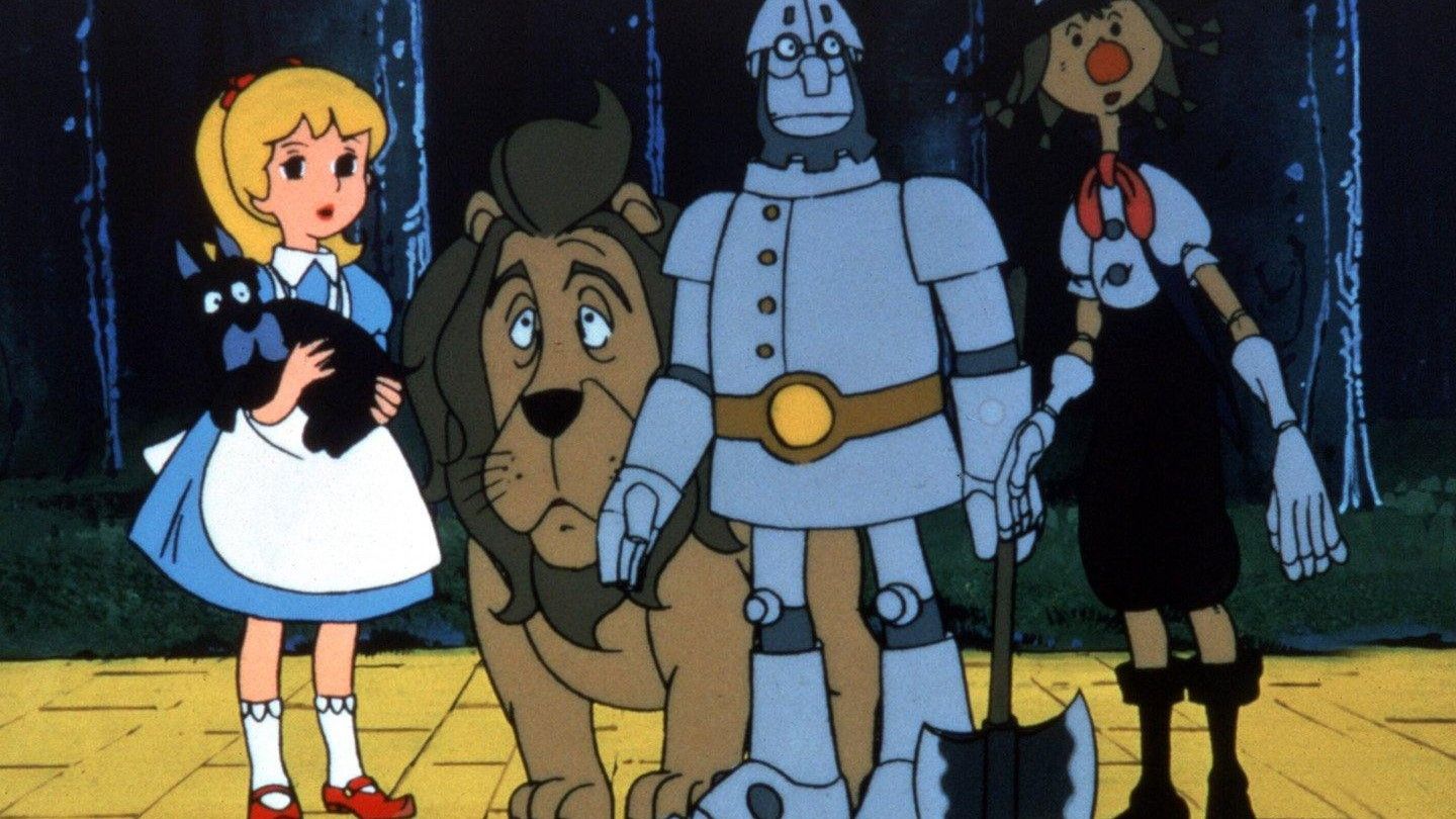 Dorothy, Toto, the lion, tin man, and scarecrow on the yellow brick road in The Wizard of Oz (1982)