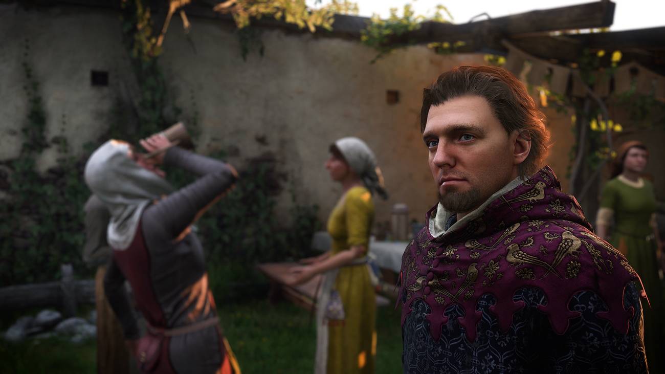 Henry stands in front of beer drinkers while thinking about the best games of 2025 in Kingdom Come Deliverance 2