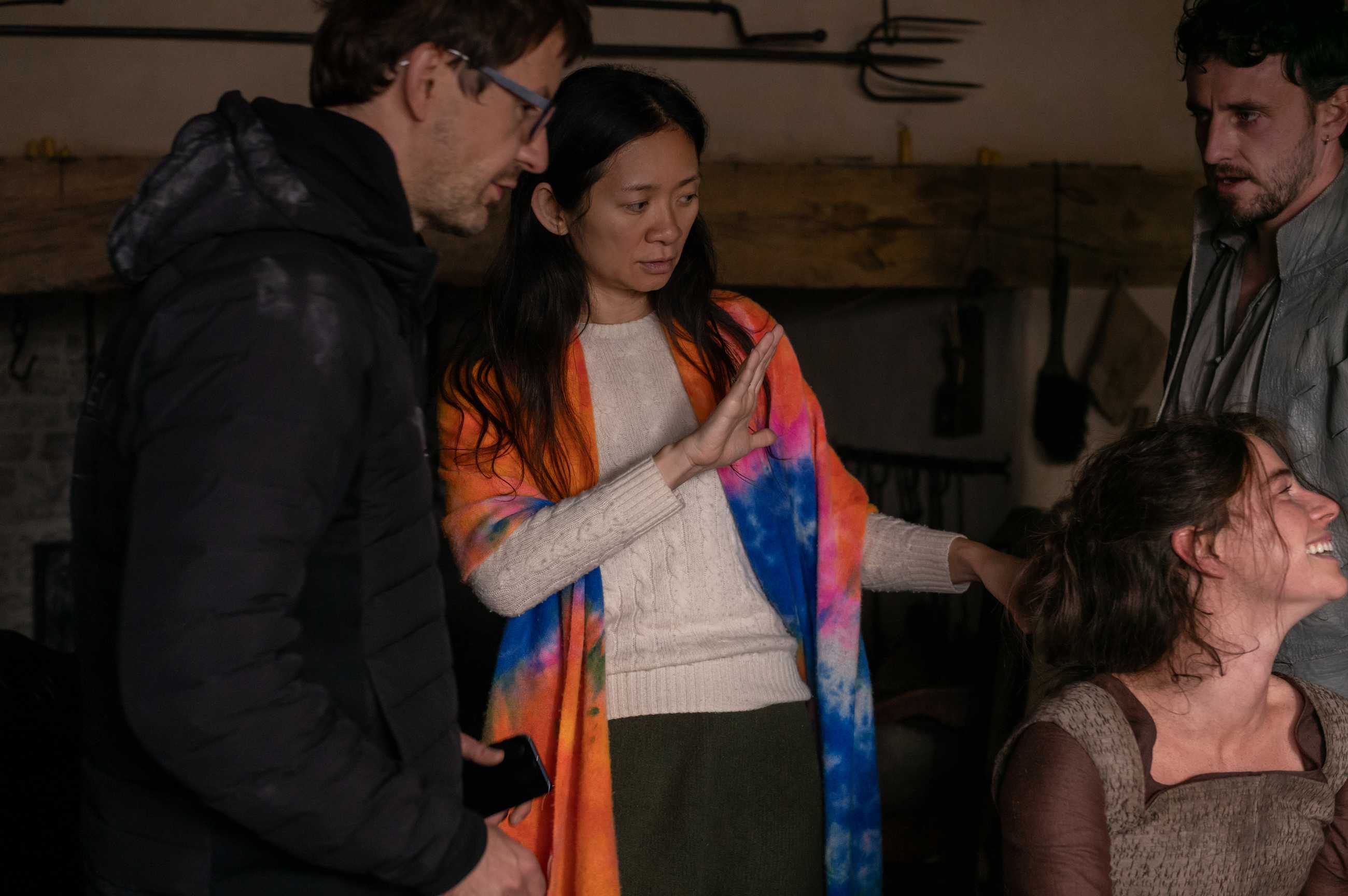 Chloé Zhao on the set of Hamnet