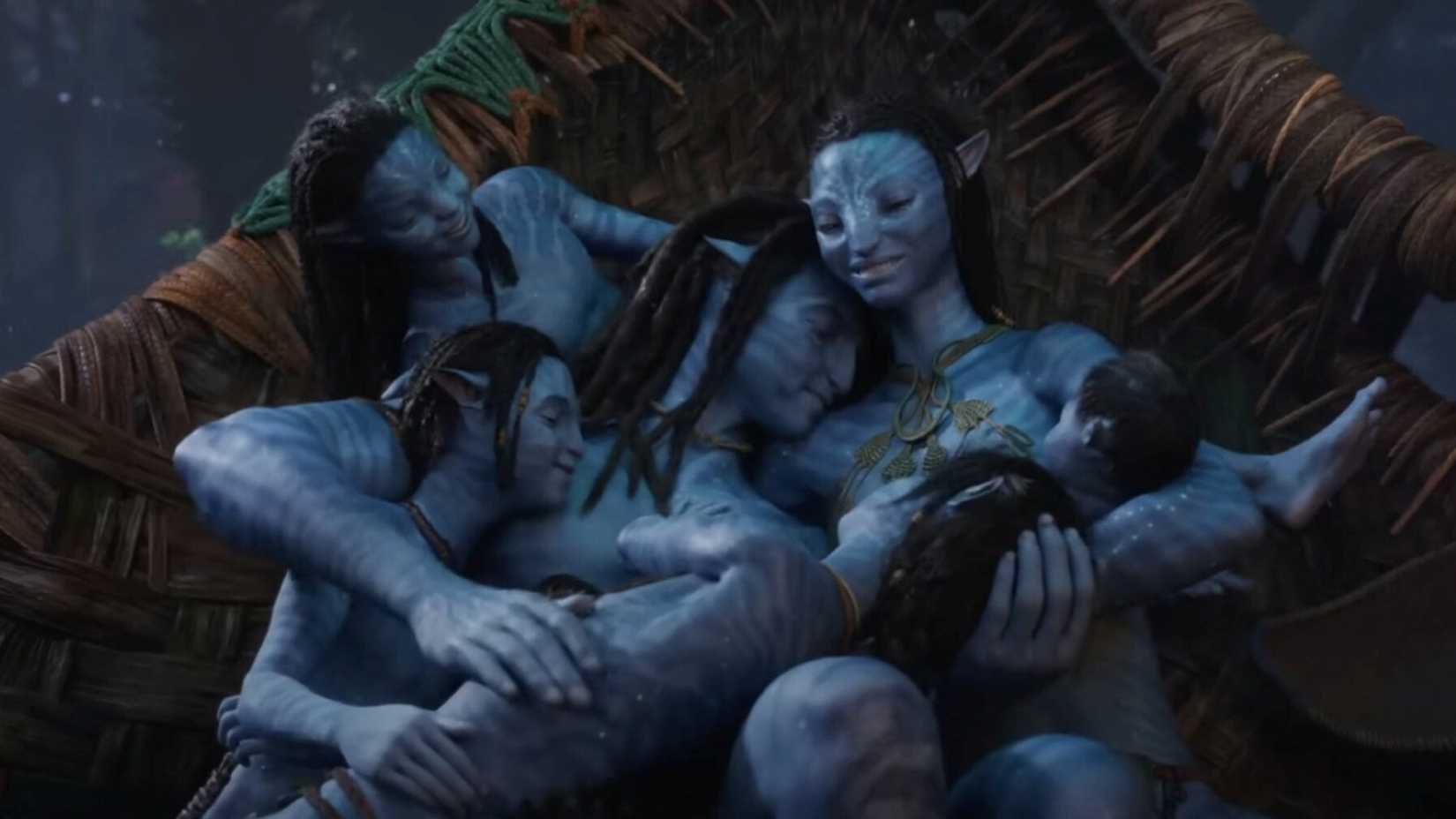 The six-member Sully family sleeps in a big blue pile in a scene from Avatar: The Way of Water