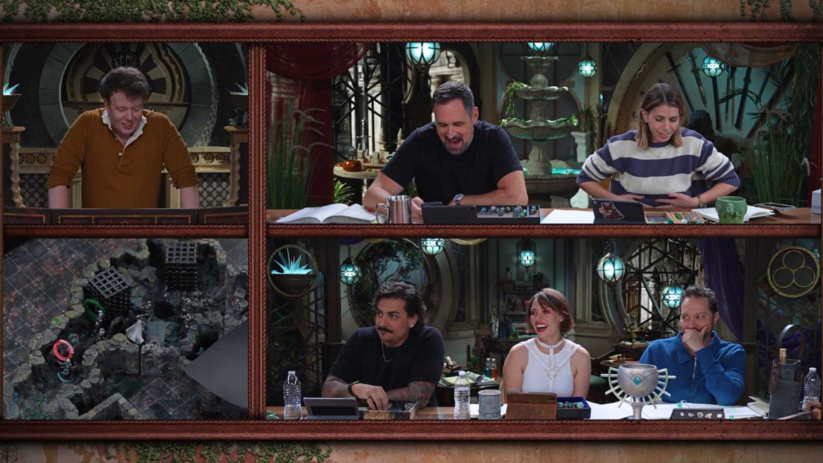 A screenshot from Critical Role Campaign 4 episode 10. It features Brennan Lee Mulligan as Dungeon Master at the top far left. Travis Willingham, Laura Bailey, Robbie Daymond, Whitney Moore, and Sam Riegel are also pictured.