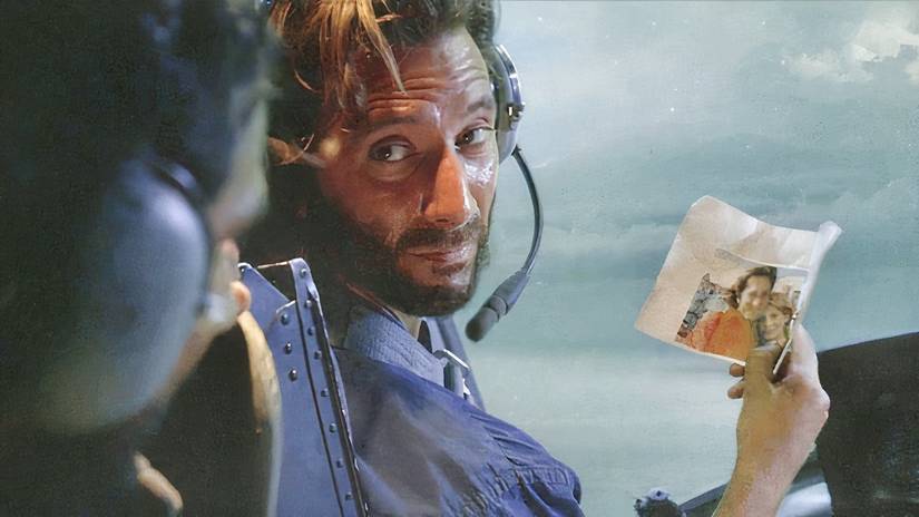 Desmond Hume holding a photo