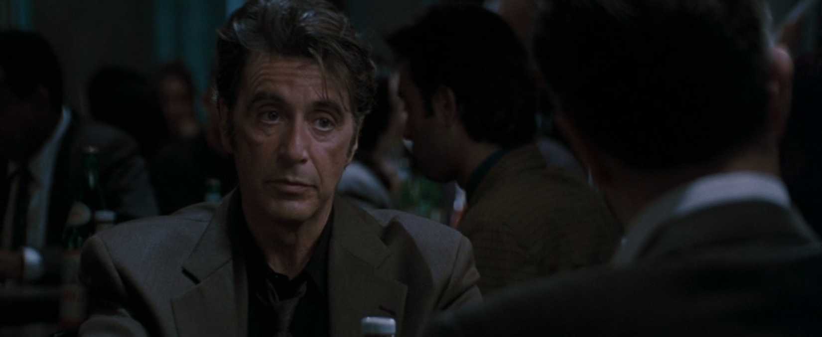 In a scene from the film Heat, the camera focuses on Al Pacino's face as he discusses life across the table from Robert De Niro. They play cop and criminal while sitting over a cup of coffee.