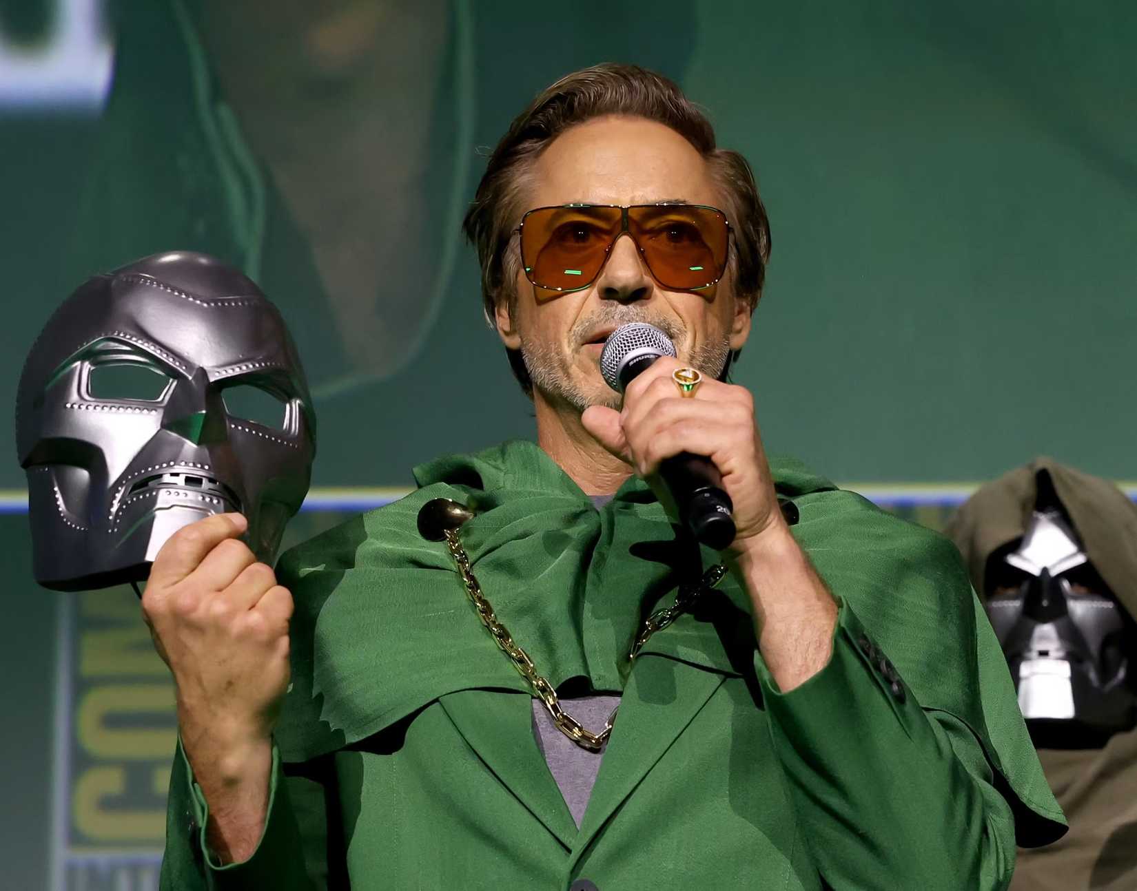 Robert Downey Jr. holds a Doomsday mask in honor of Fantastic Four: First Steps sequel Avengers: Doomsday at SDCC 2024