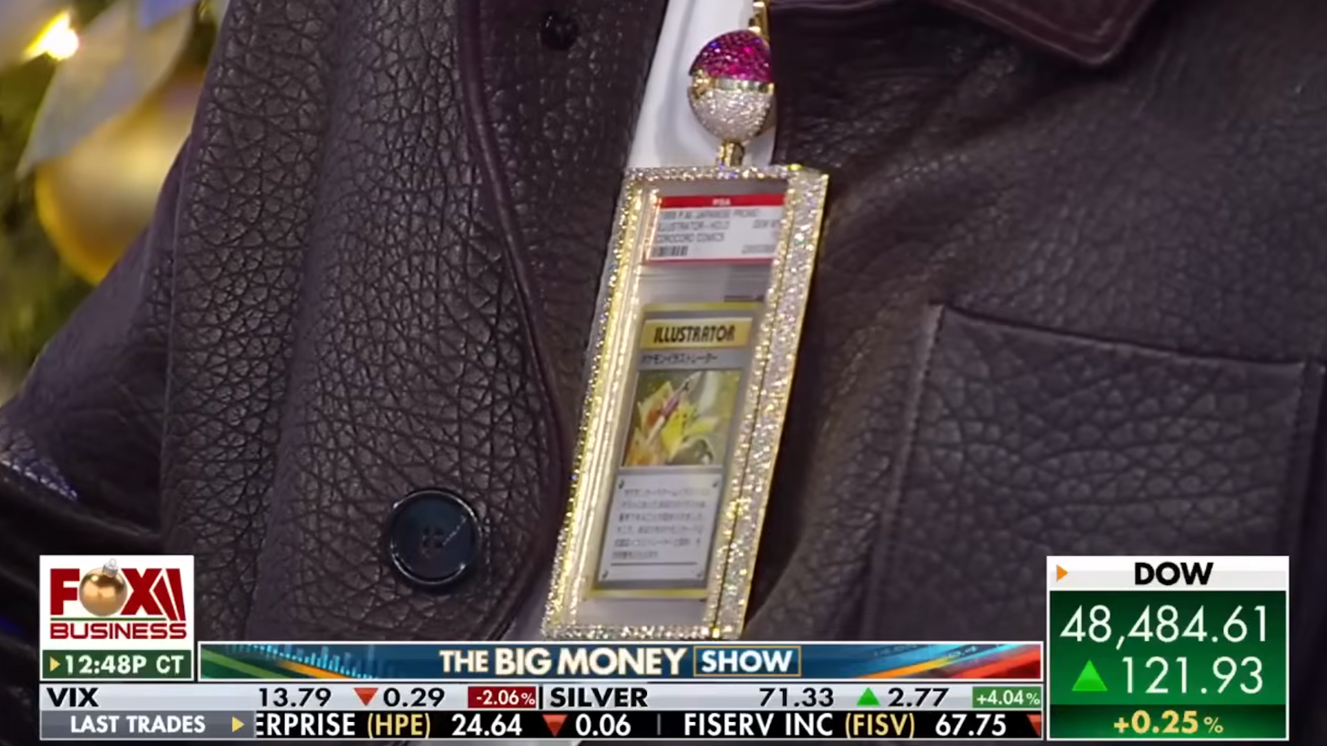 Logan Paul showcasing the Pikachu Illustrator card