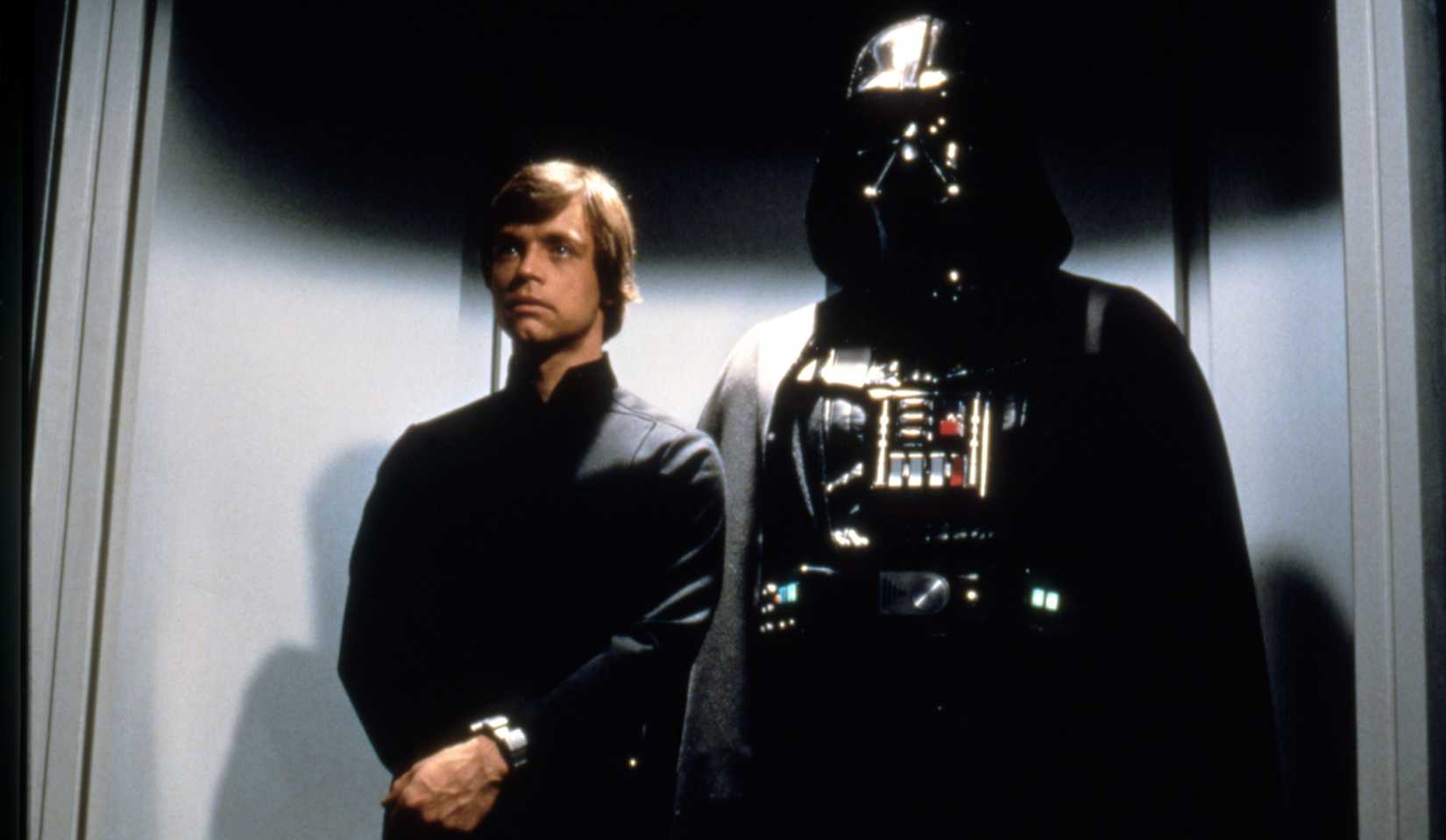 Luke Skywalker and Darth Vader share an awkward elevator ride on their way to a meeting with the Emperor in a scene from Return of the Jedi