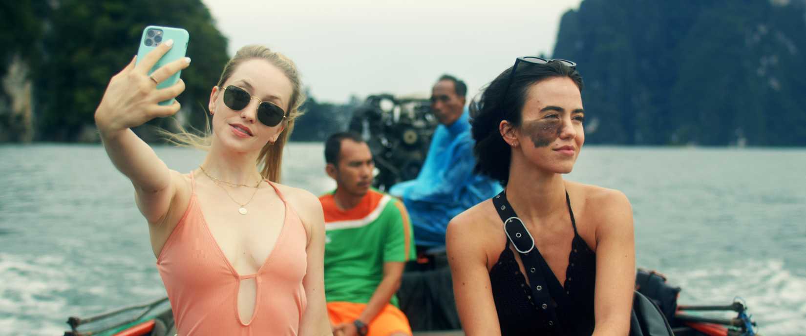 Madison takes a selfie next to CW while on a boat in Influencer