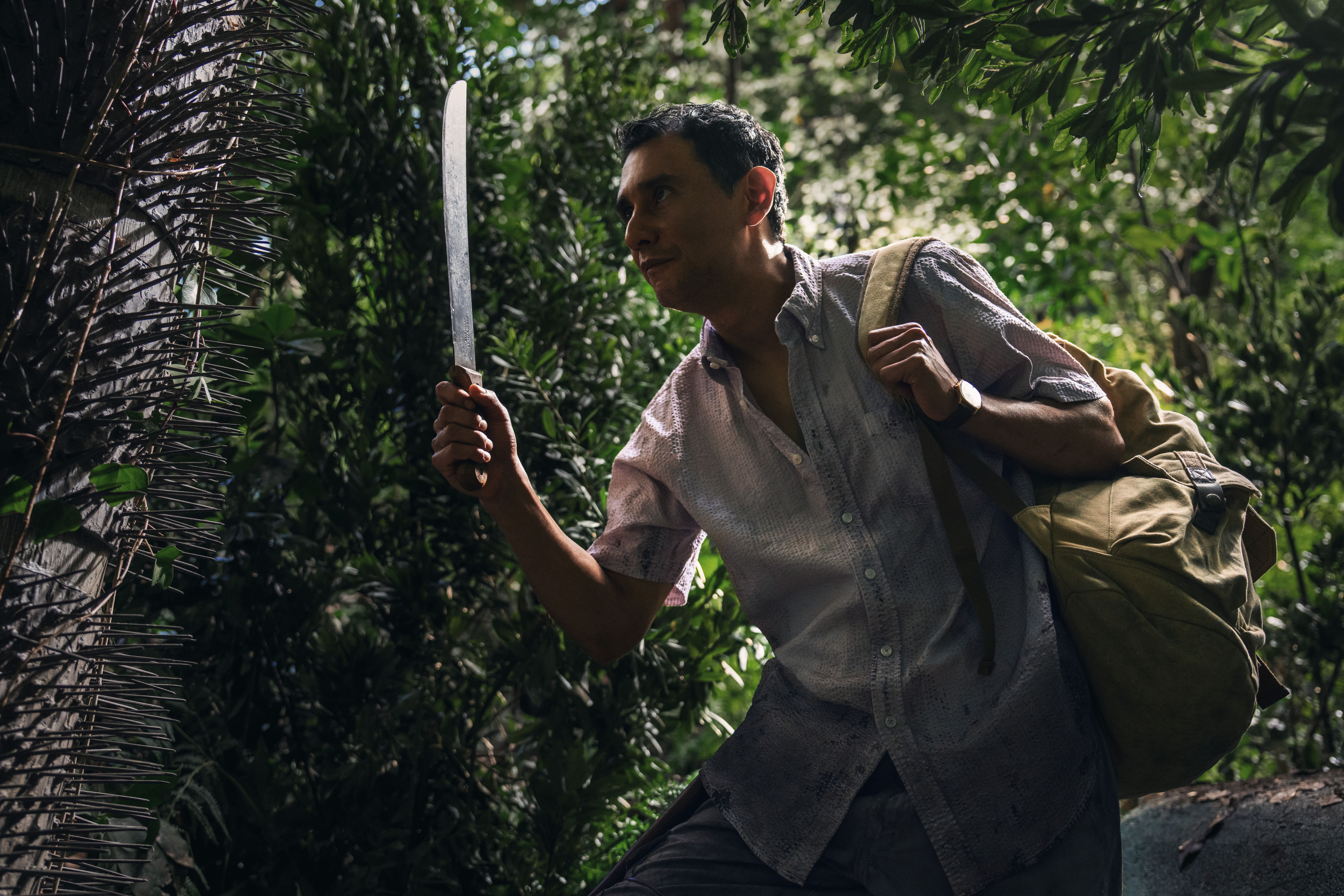 Carlos-Manuel Vesga as Manousos navigating the jungle in Pluribus
