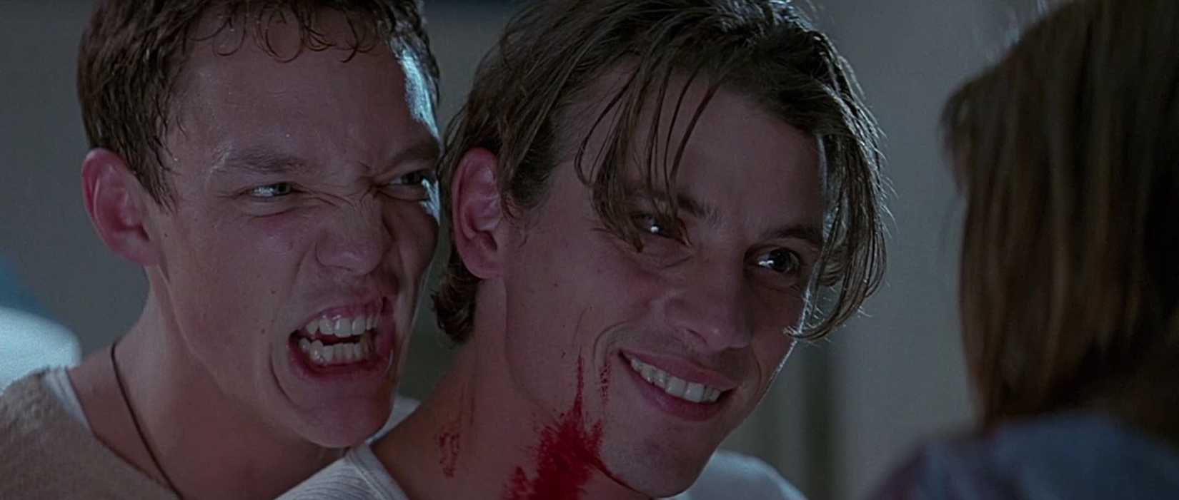 Matthew Lillard and Skeet Ulrich staring down Neve Campbell in Scream