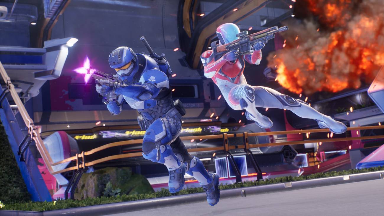 Two characters fire guns in Splitgate: Arena Reloaded.