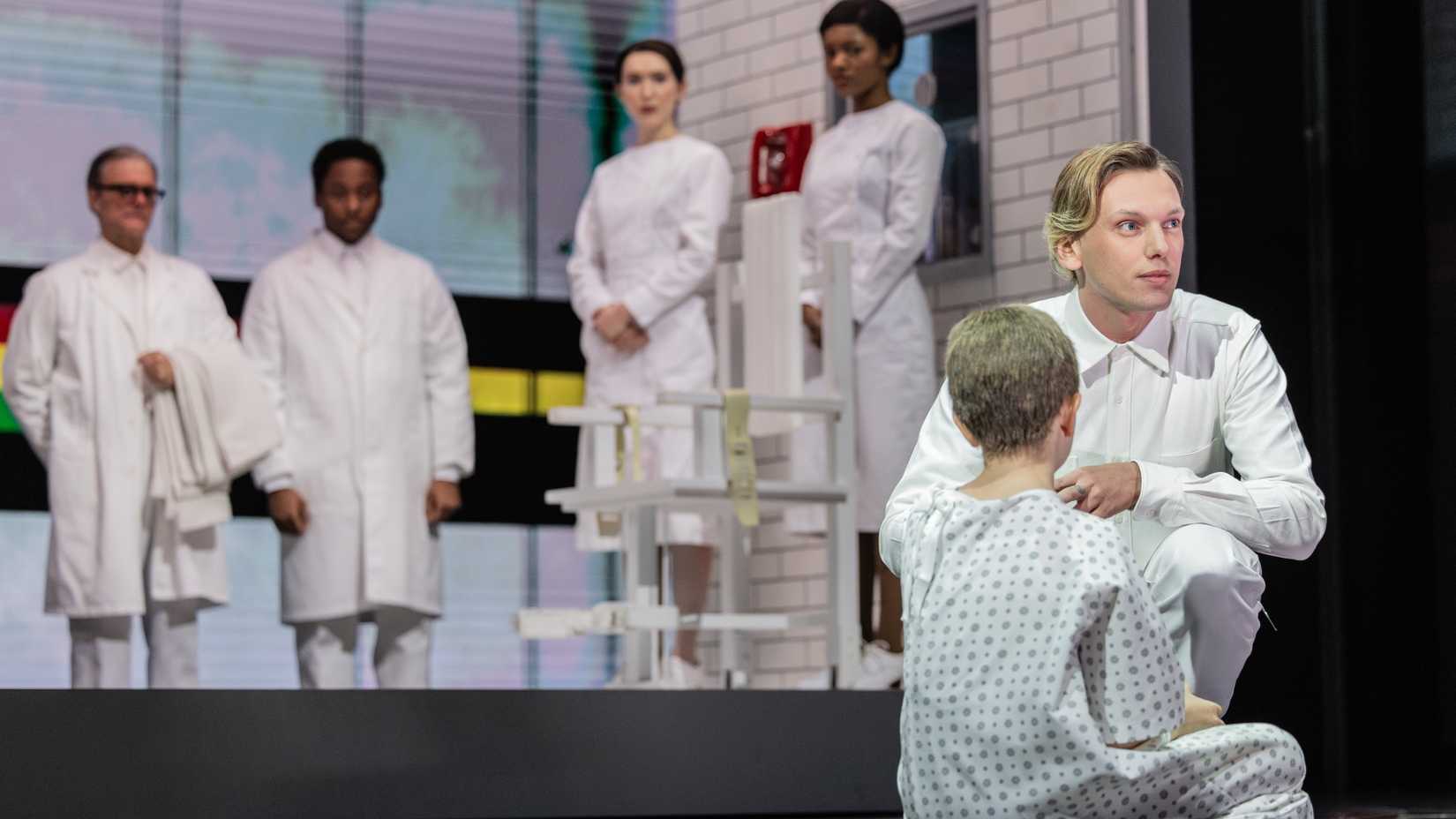 Jamie Campbell Bower appears on stage in a production of Stranger Things: The First Shadow in New York as One talking to Eleven