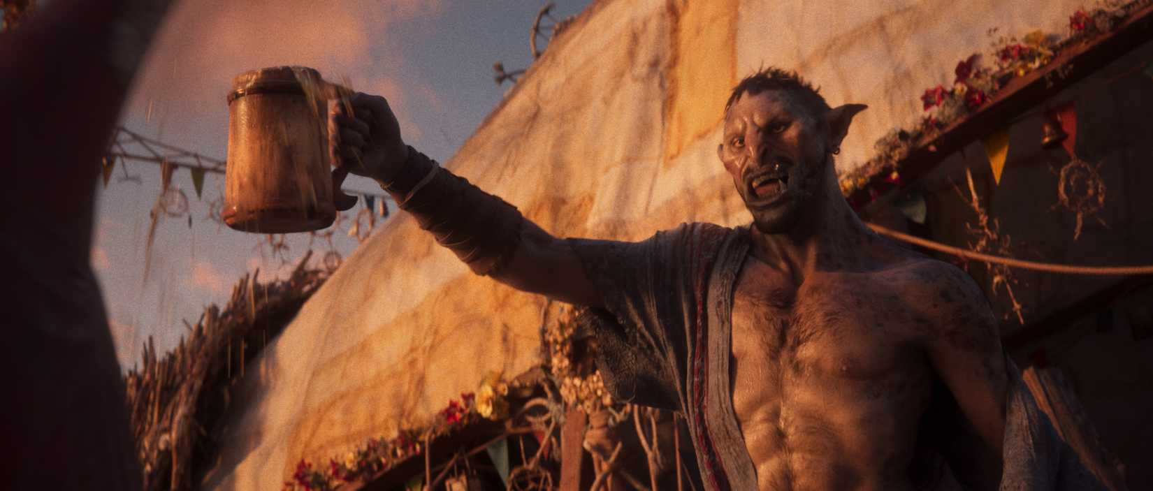 A screenshot from Divinity showing an orc raising a flagon of ale