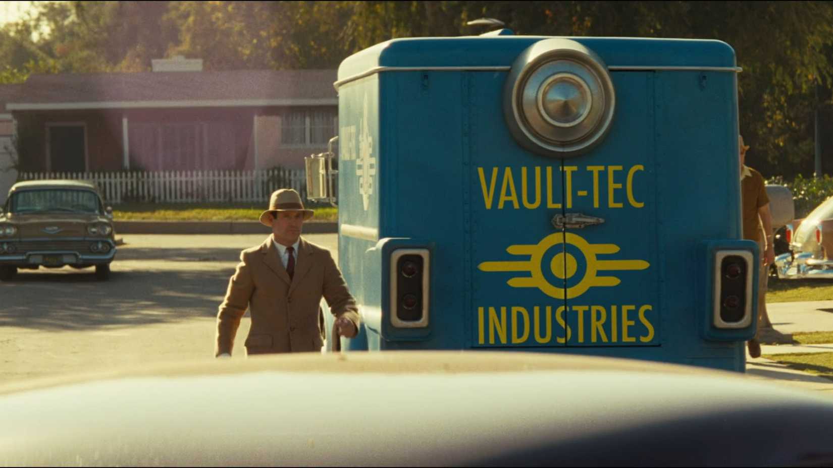 Vault Tec personnel walking around the car in Fallout Season 2 Episode 1.