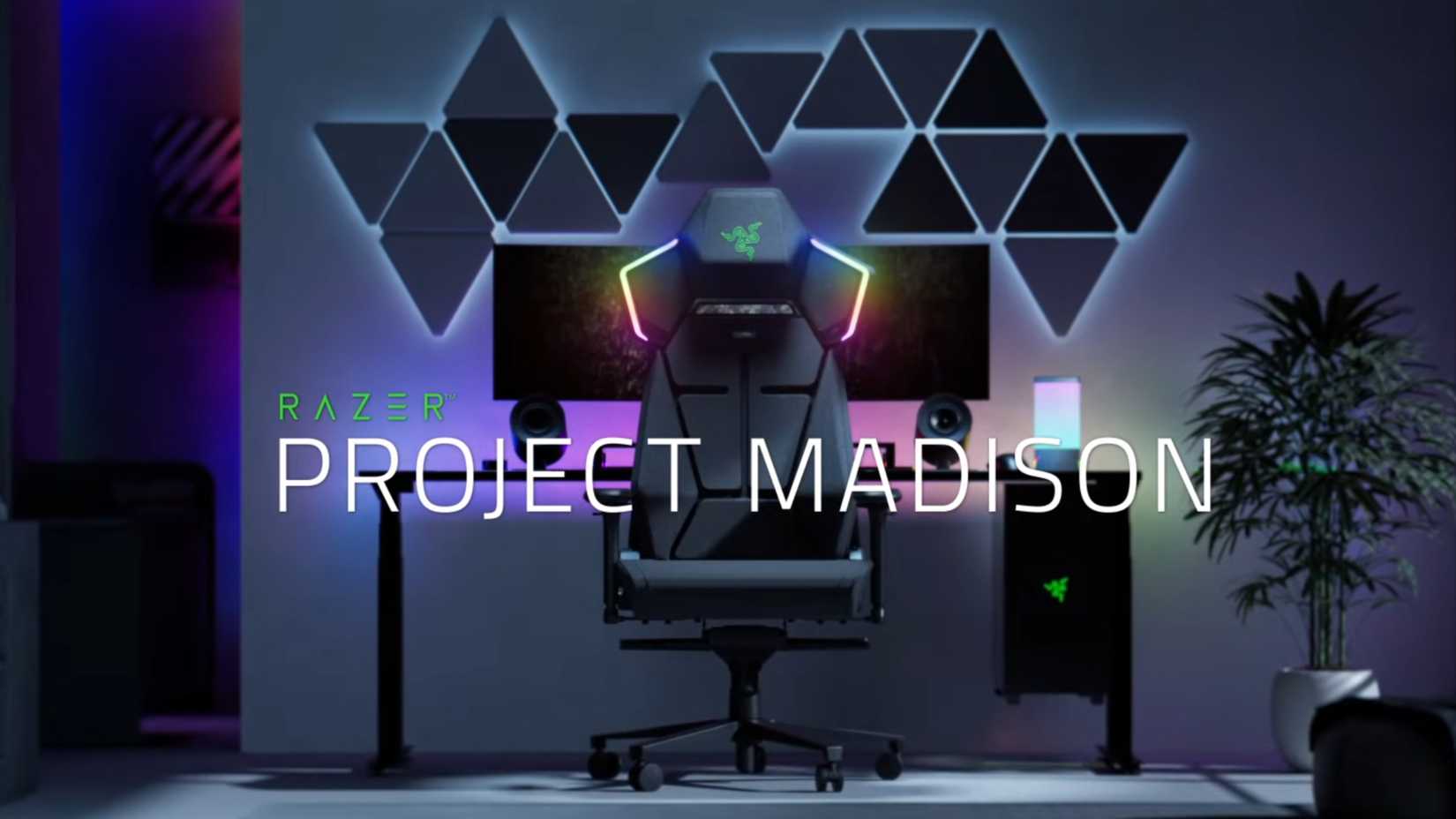Razer's Project Madison gaming chair, sitting in from of a desk with a computer on it.