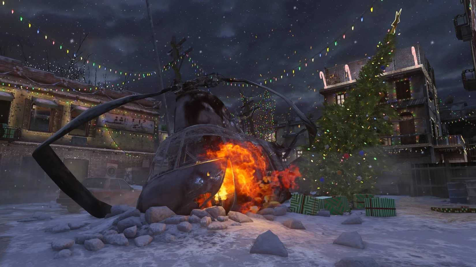 The crashed helicopter in Winter Crash on Modern Warfare Remastered with the Christmas tree next to it.