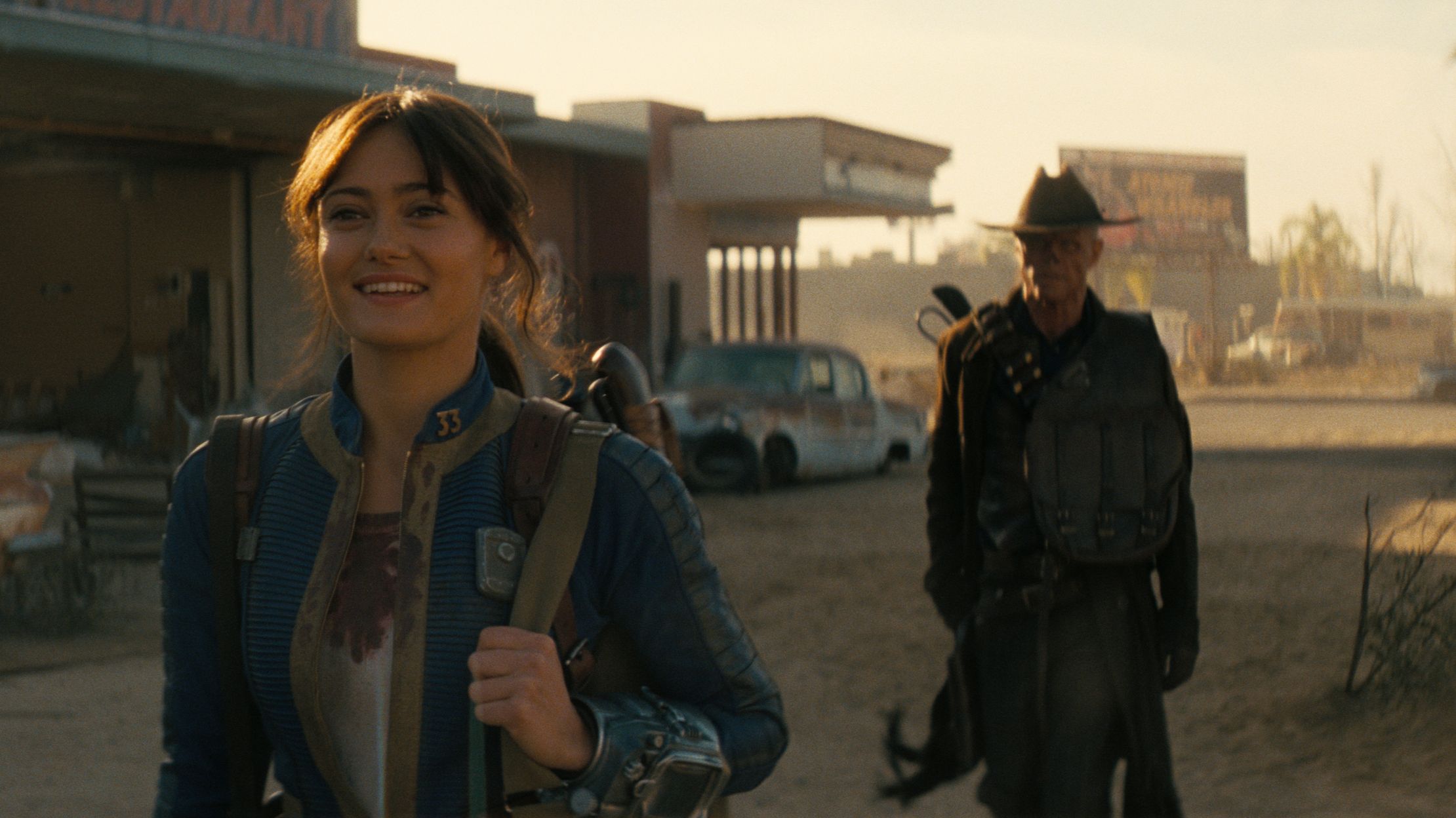 Lucy (Ella Purnell) and The Ghoul (Walton Goggins) traveling toward New Vegas in Fallout season 2.