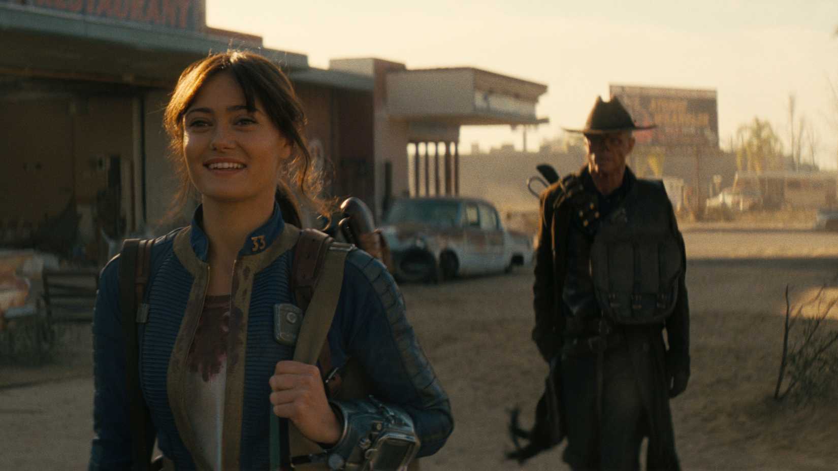 Lucy (Ella Purnell) and The Ghoul (Walton Goggins) traveling toward New Vegas in Fallout season 2.