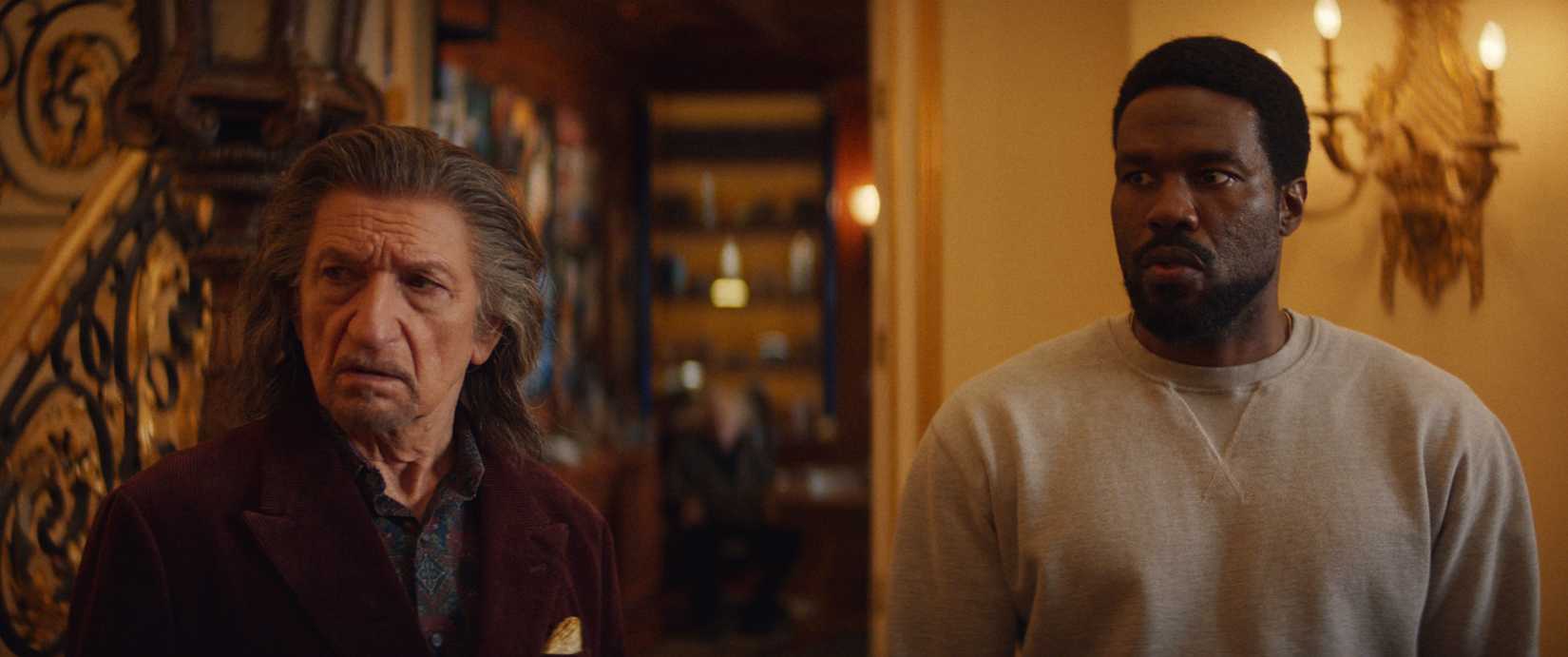 Simon (Yahya Abdul-Mateen II) and Trevor (Ben Kingsley) stand together, looking baffled, in Wonder Man