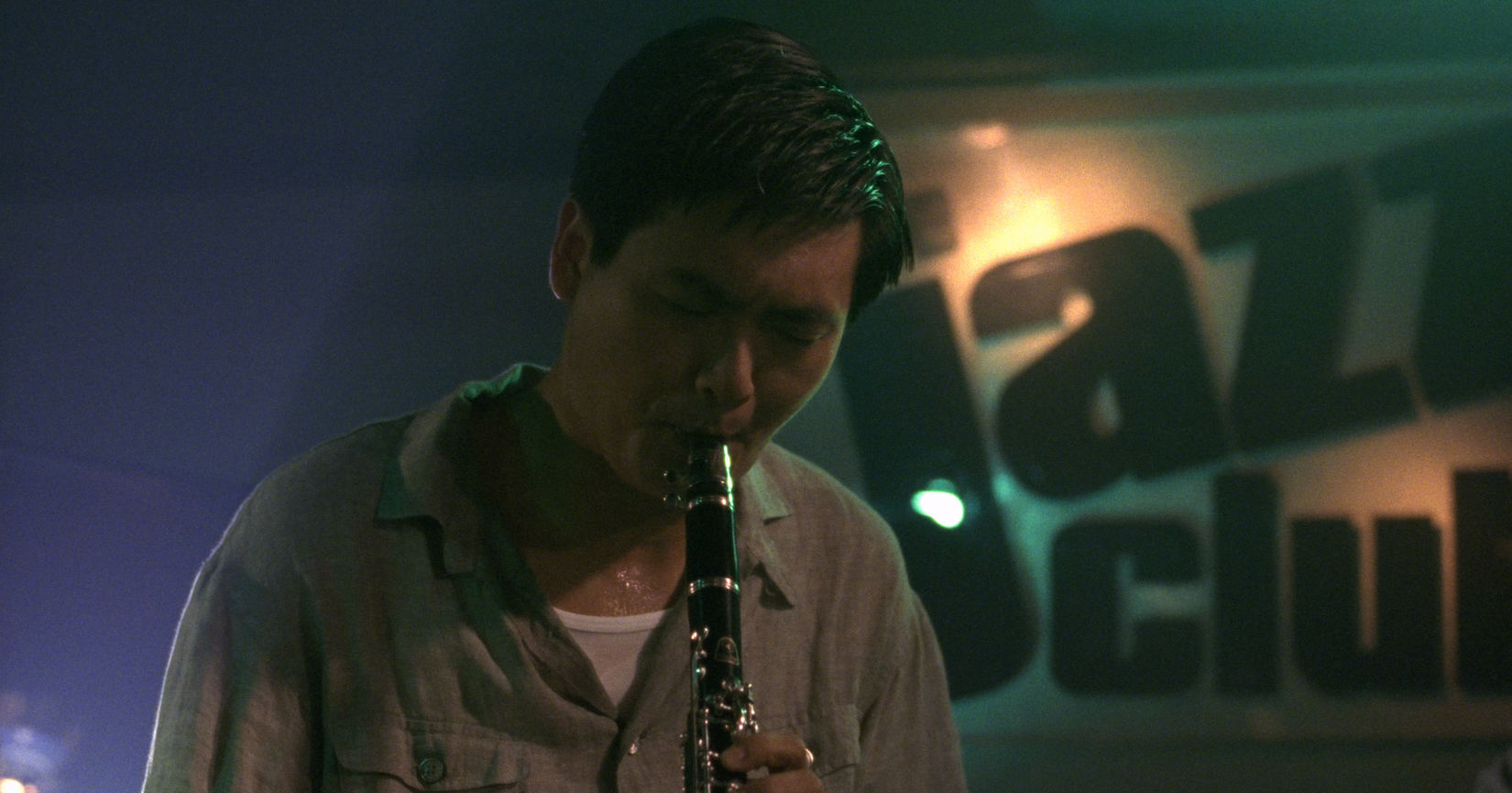 Inspector Tequila playing the clarinet in the opening credits of Hard Boiled