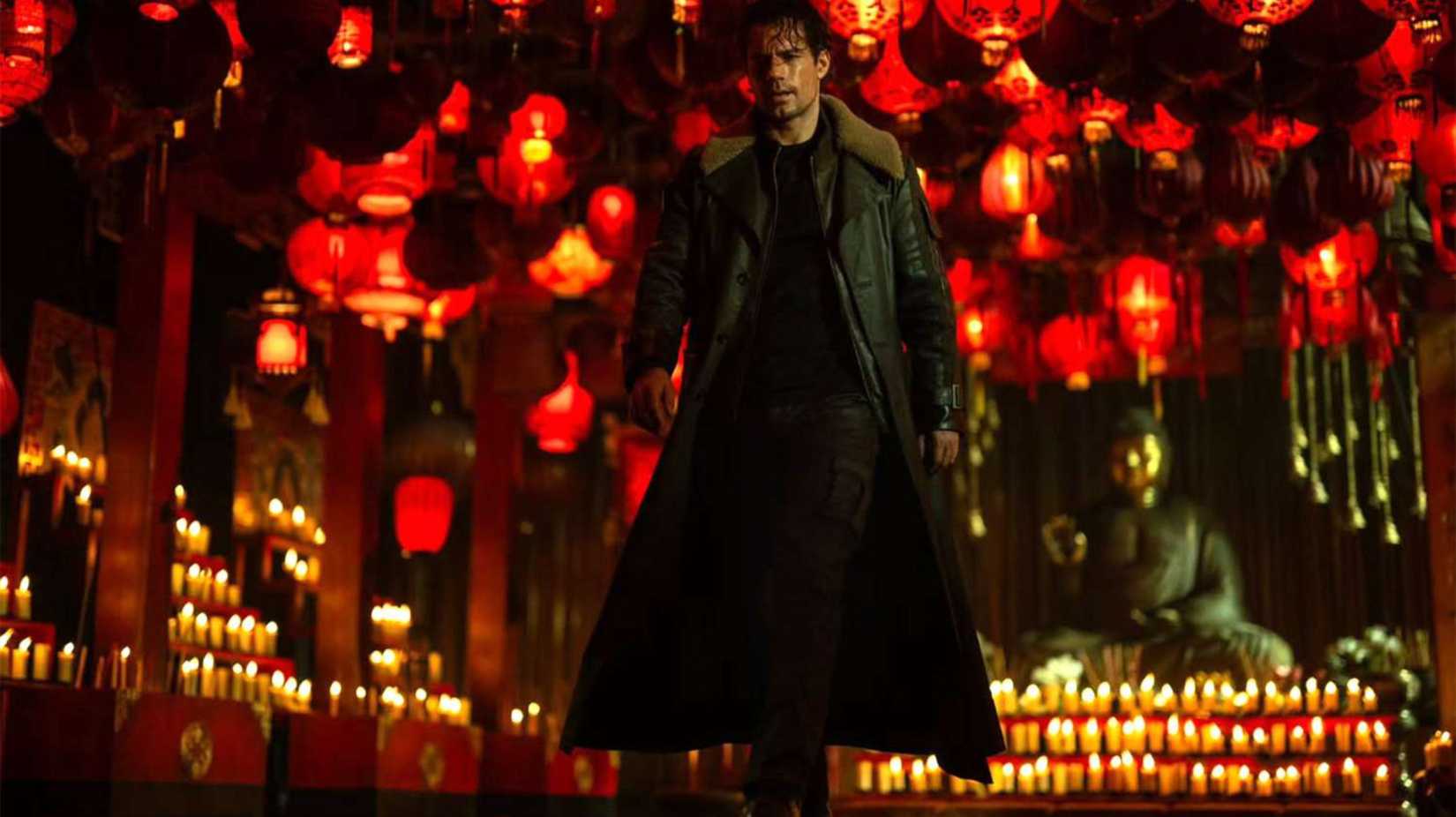 Henry Cavill in a room fully lit by candles in the upcoming Highlander reboot