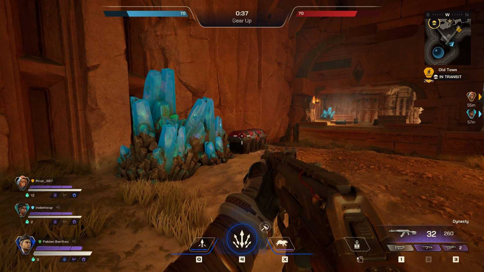 The player in Highguard wielding an assault rifle and looking at a vesper cluster next to a weapon crate.