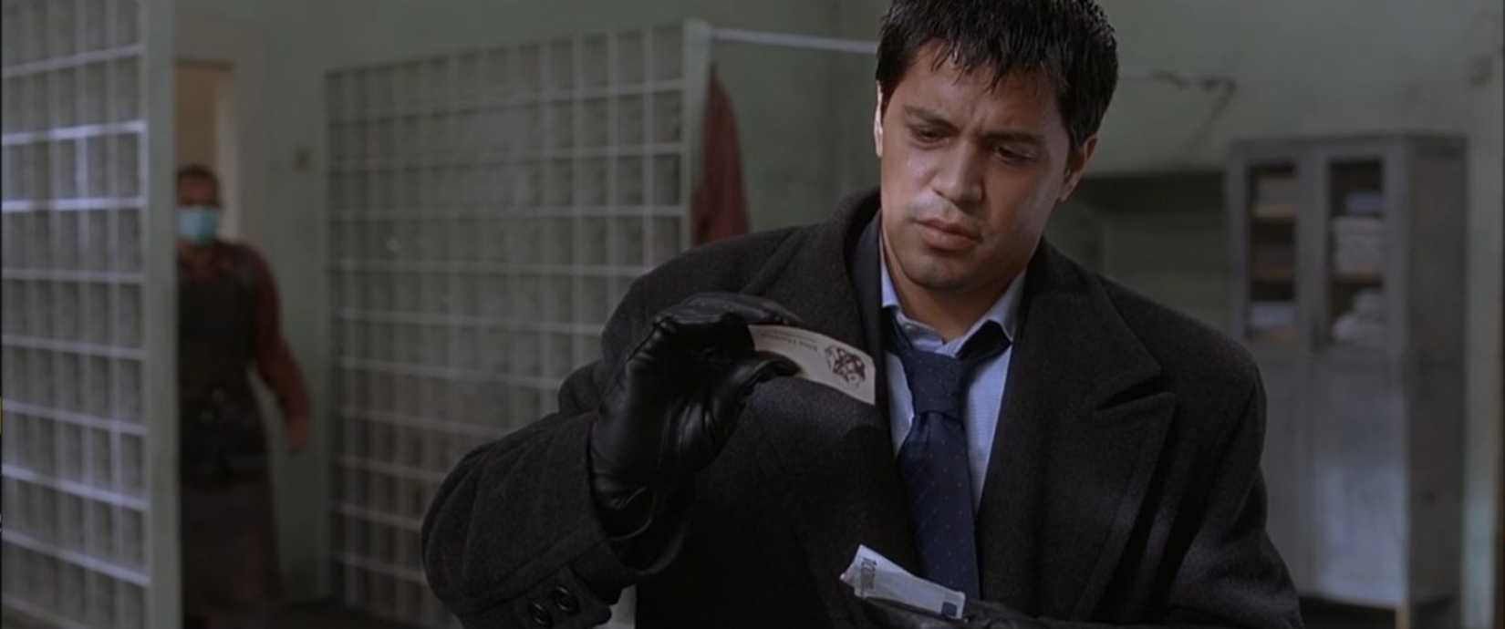 A callow young person (Jay Hernandez) pokes around the changing room of a secret torture club in a scene from Hostel (2006). 