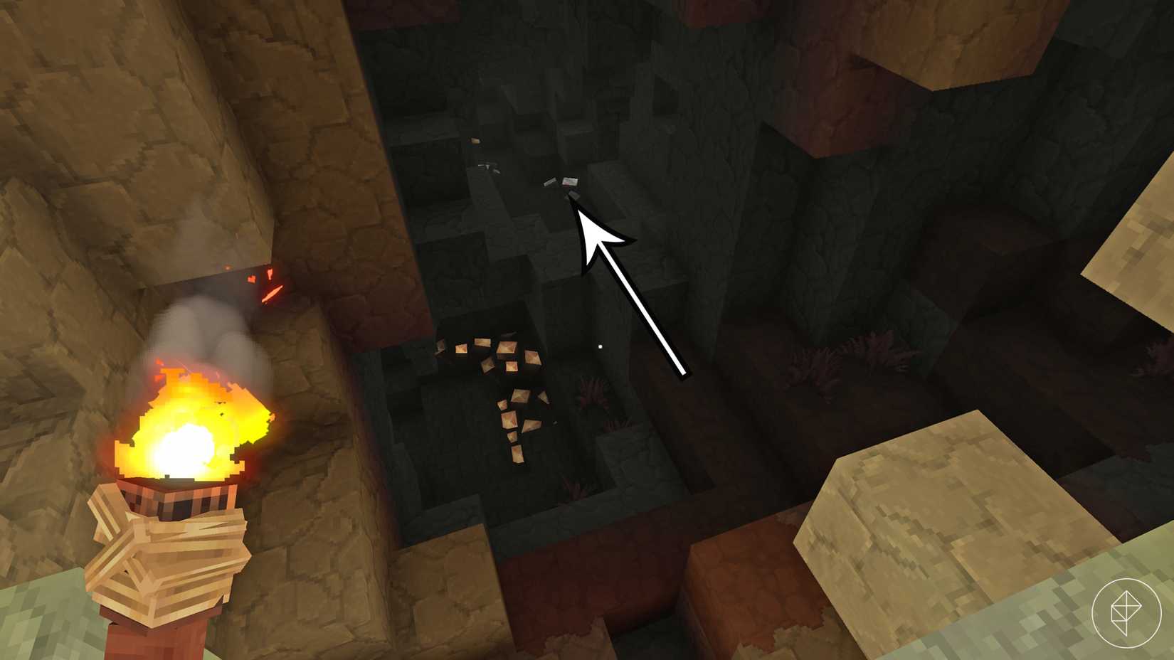 A shimmering iron ore vein inside a dimly lit cave in Hytale.