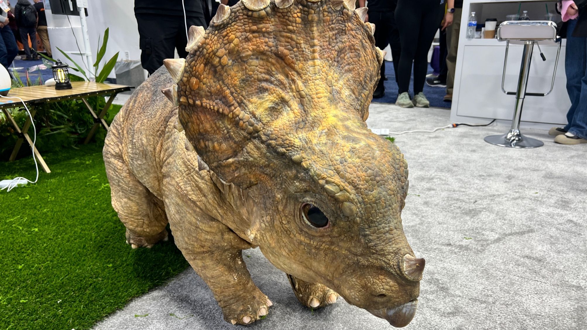 A robotic pet dinosaur as Dorobot's CES 2026 booth.