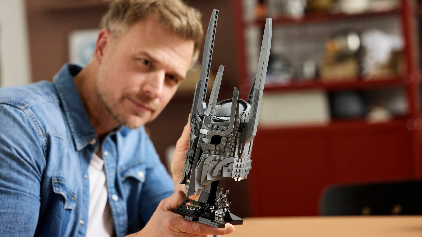 Photo of a man building the Lego Lord of the Rings Sauron helmet set