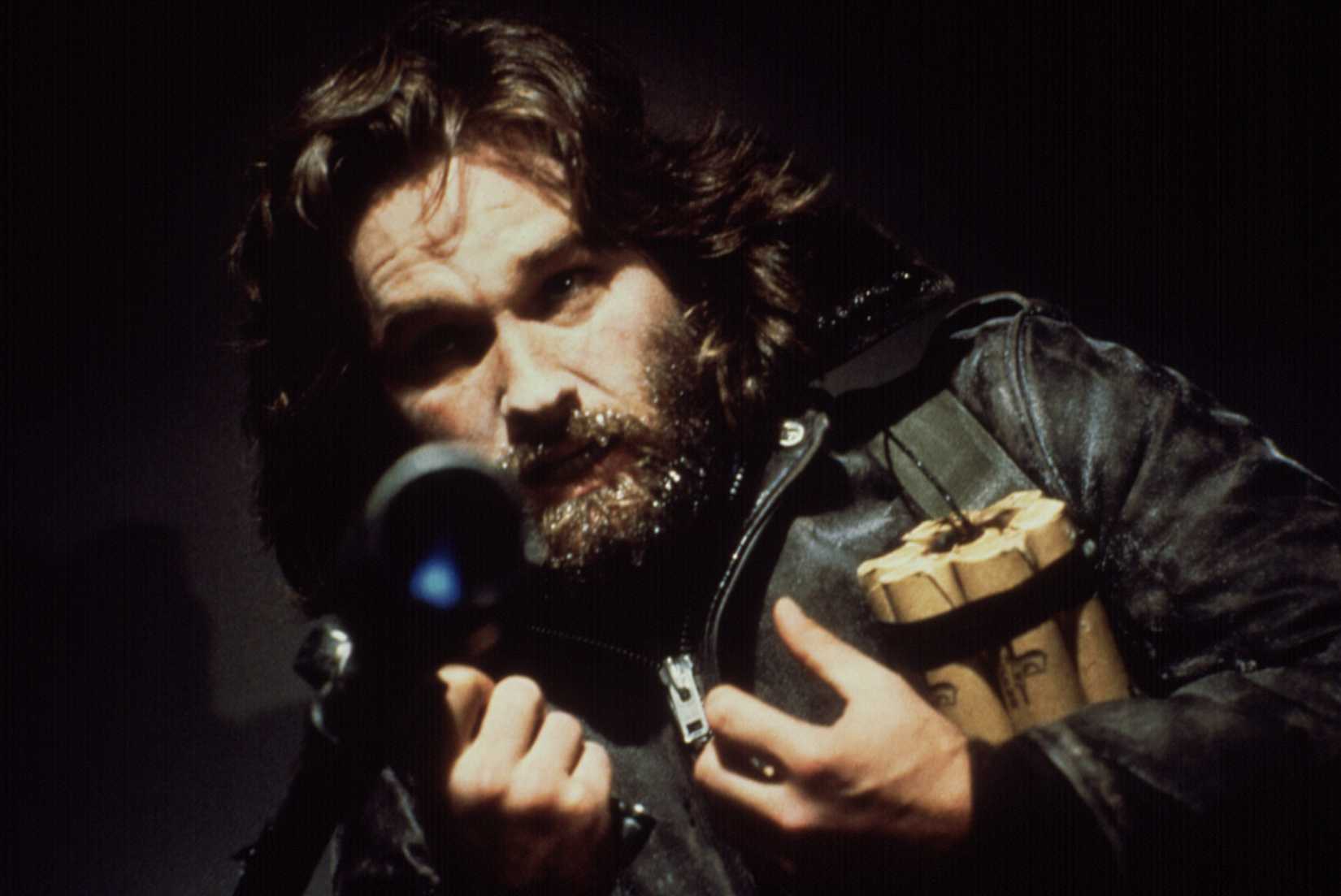A distressed MacReady holds on to the dynamite in John Carpenter's The Thing