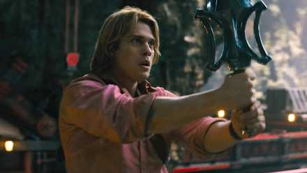 Prince Adam (Nicholas Galitzine) holds up the power sword in a still from Masters of the Universe (2026)