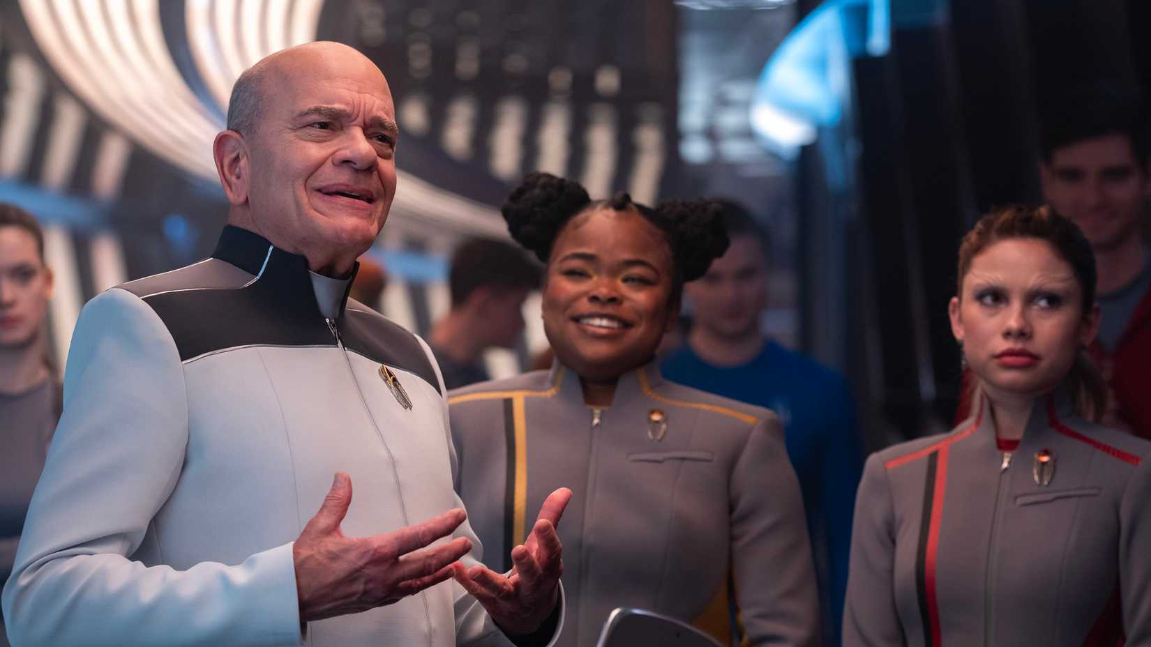 The Doctor (Robert Picardo) speaks with SAM (Kerrice Brooks) and Genesis (Bella Shepard) in Starfleet Academy