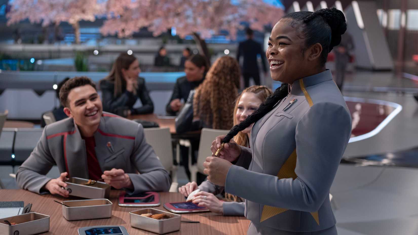 Darem Reymi (George Hawkins), Genesis (Bella Shepard) and SAM (Kerrice Brooks) have lunch in Starfleet Academy
