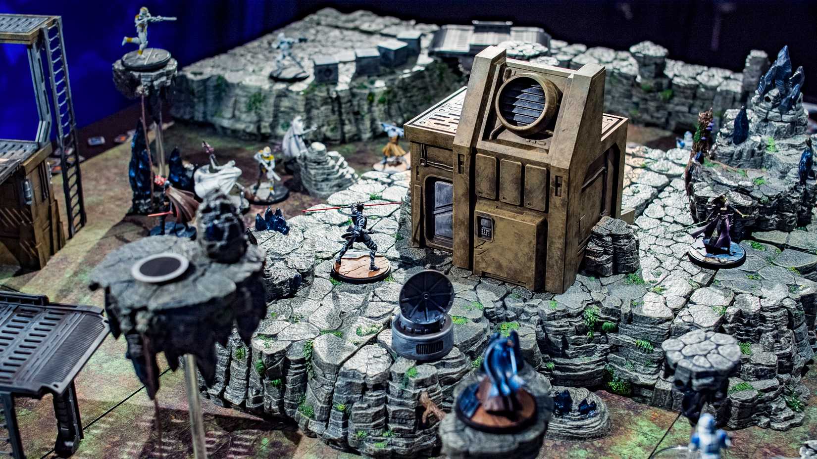  Shatterpoint figures are positioned around mountainous terrain from Dwarven Forge