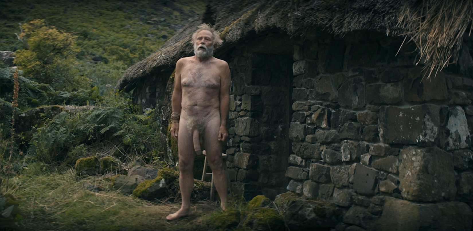Ser Arlan Pennytree (Danny Webb) stands naked outside a small home showing off his giant dong in A Knight of the Seven Kingdoms