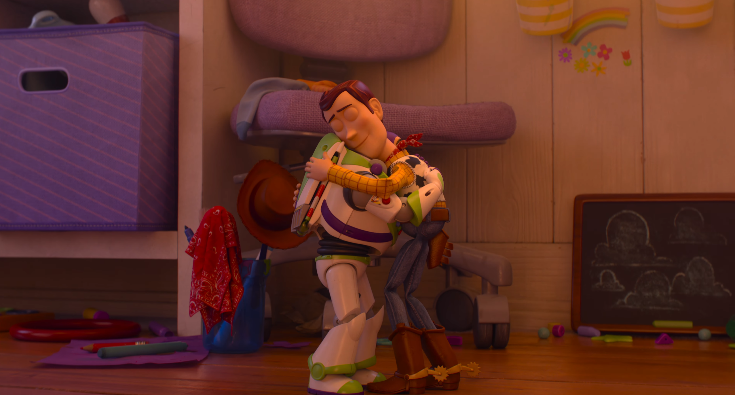 Woody and Buzz Lightyear share an emotional embrace in a scene from Toy Story 5