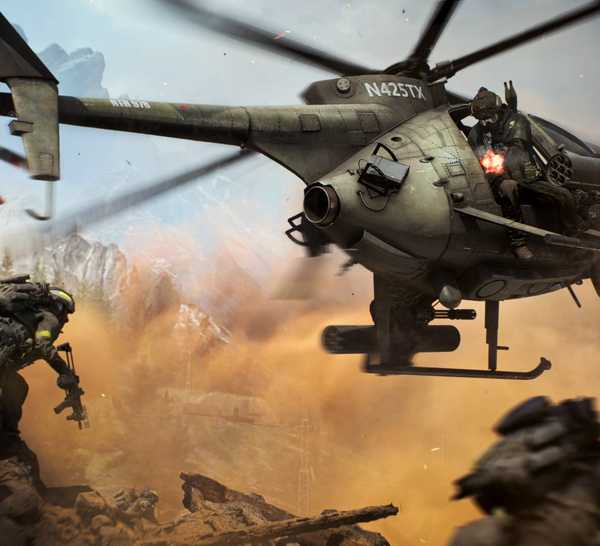 The Little Bird helicopter in Battlefield 6 flying above some enemy soldiers on a hill.
