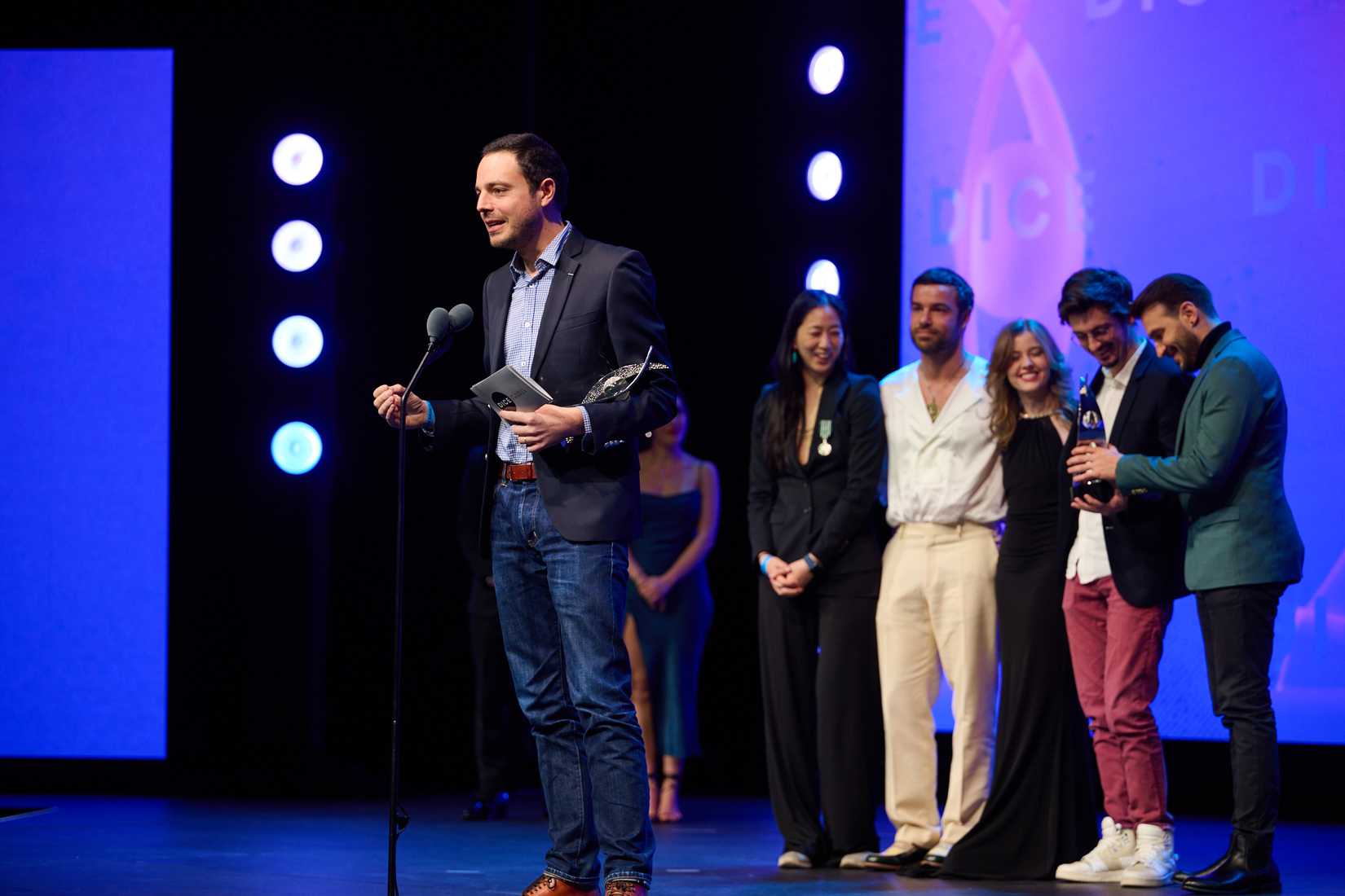 The Sandfall Inteactive team accepts the DICE Award for Game of the Year