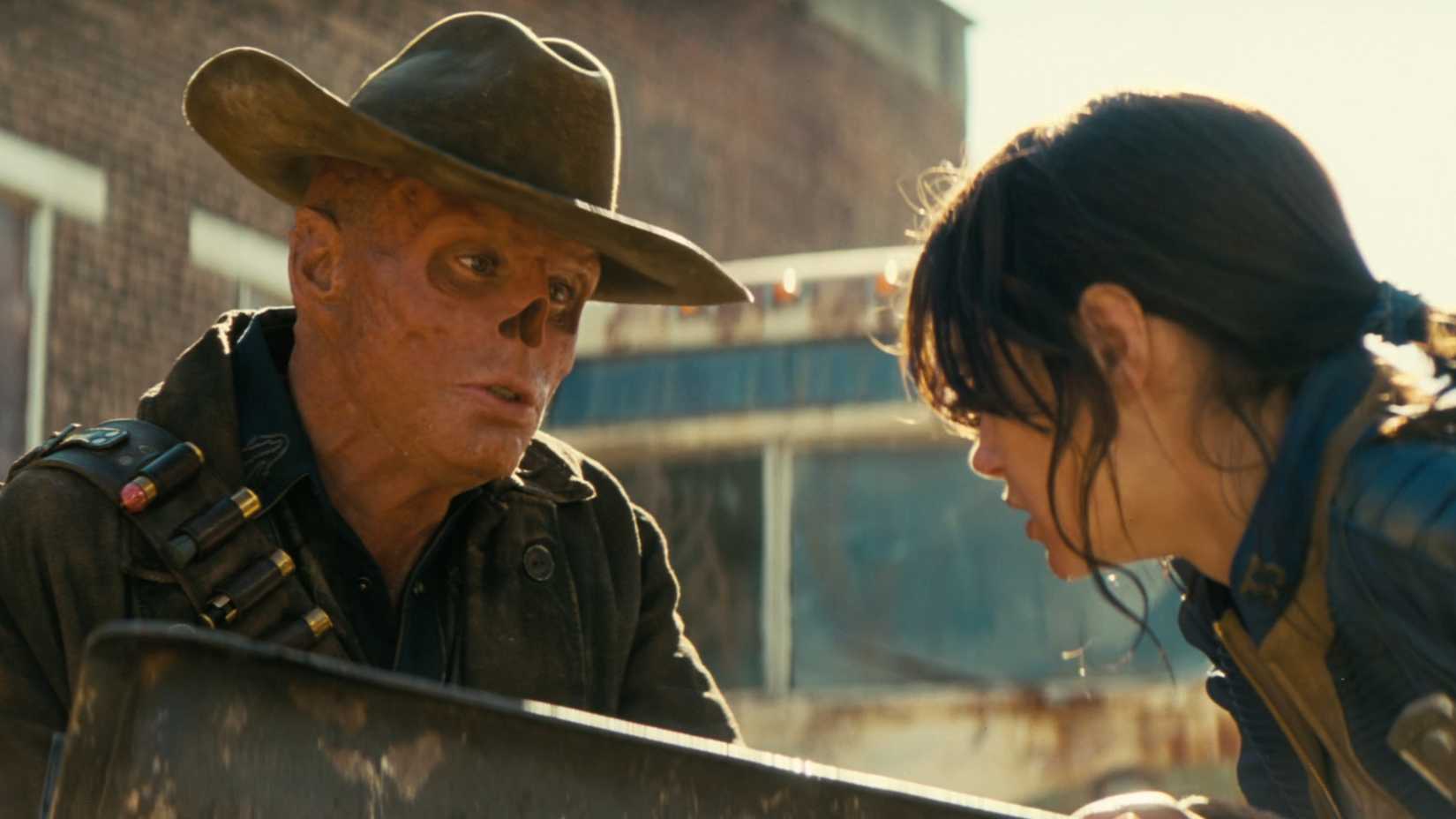 As Lucy drinks irradiated water, The Ghoul crouches down to watch, telling her she's eventually going to turn into him.