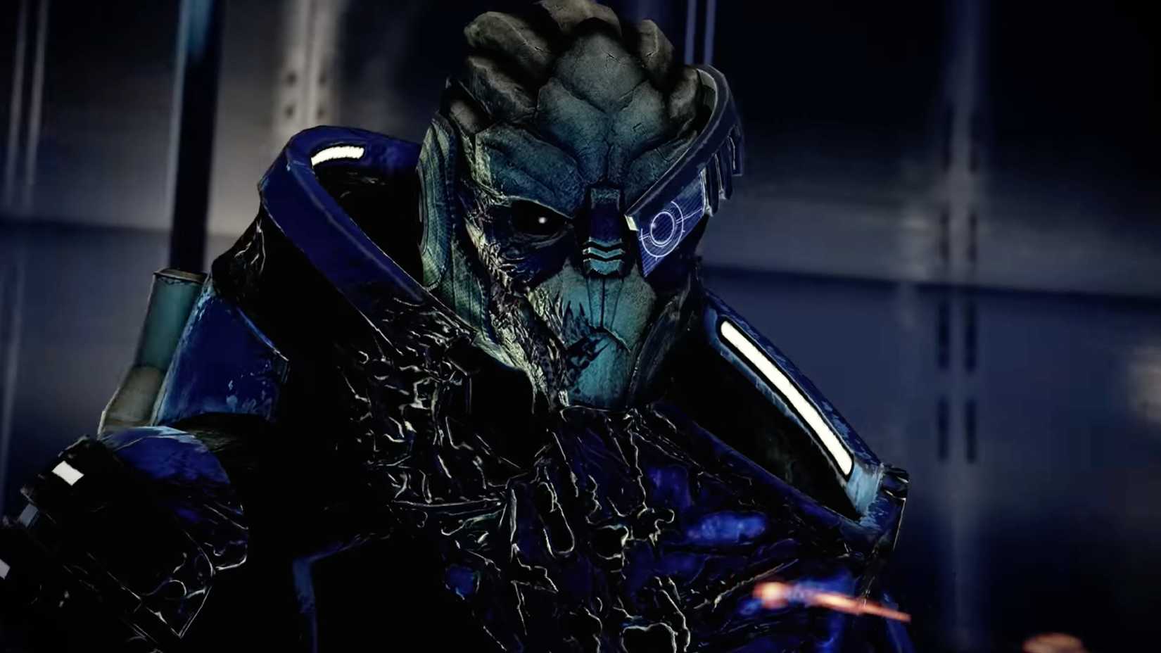 A close-up of Garrus, an alien from Mass Effect, wearing blue armor and a visor over one eye.