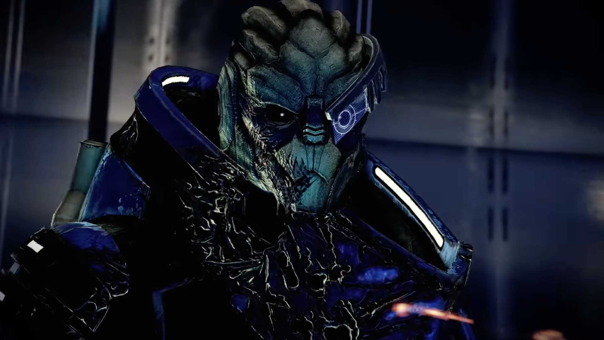 A close-up of Garrus, an alien from Mass Effect, wearing blue armor and a visor over one eye.