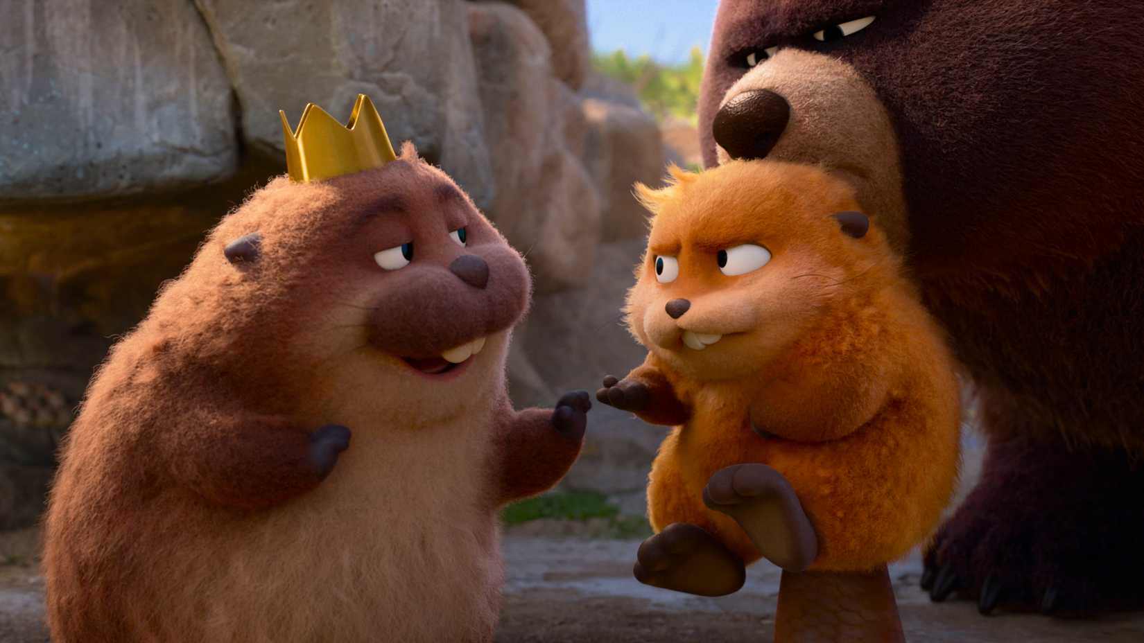 A bear holds a small beaver in its mouth and presents her to a larger beaver wearing a crown in Hoppers