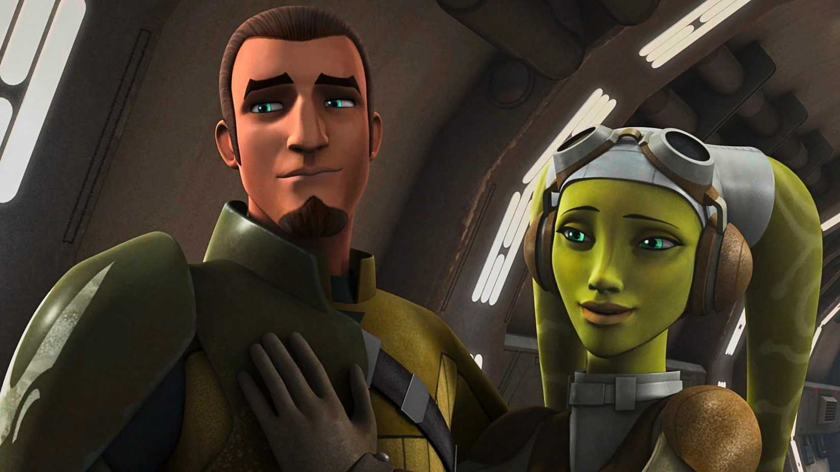 An image of Kanan and Hera from Star Wars: Rebels. Kanan is a human male with a goatee and cropped brown hair. He wears a green and yellow-ish outfit. Beside him, touching his chest, is Hera. Hera is a green Twi'lek alien from Star Wars. She wears goggles and has a proud expression on her face.